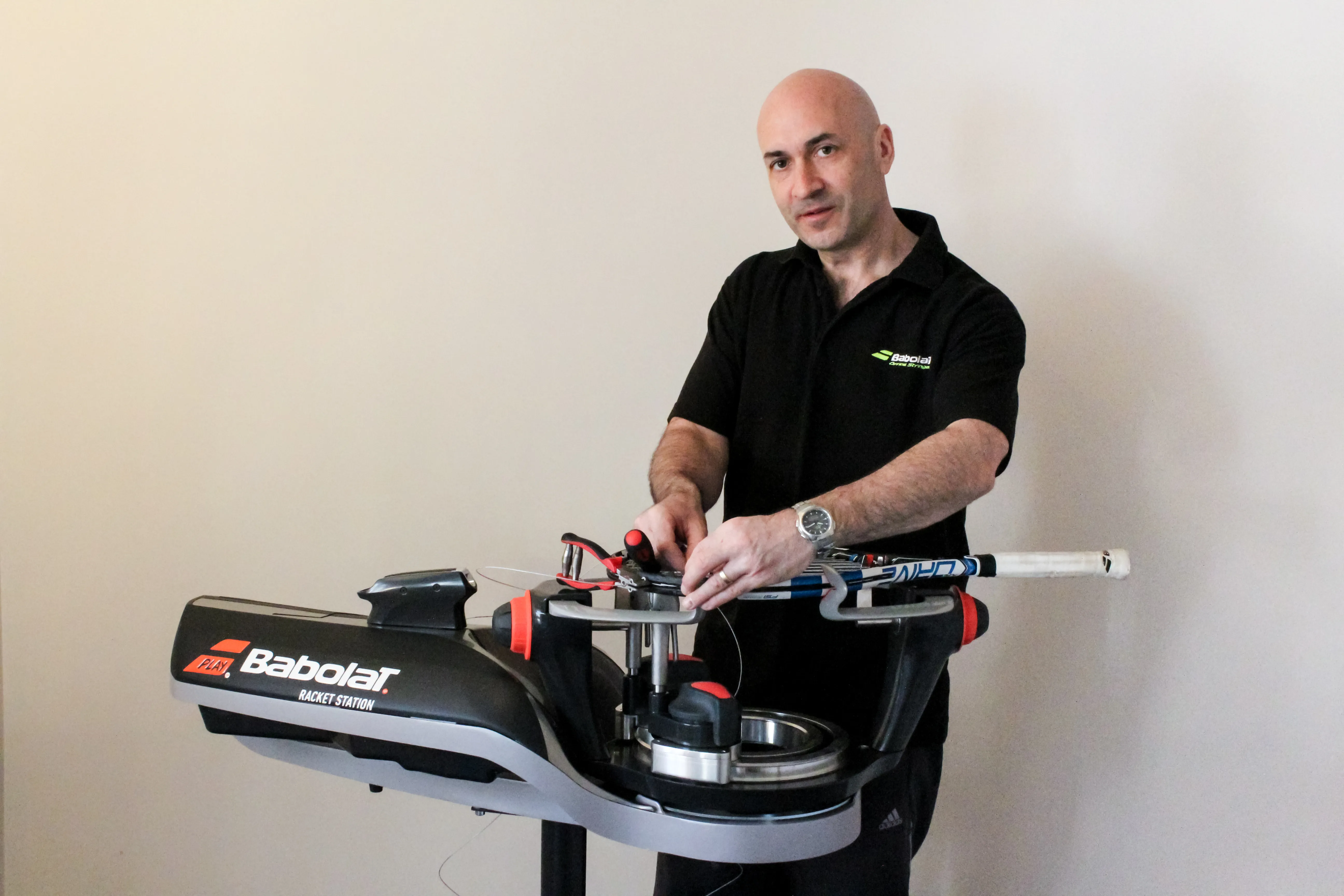 Peter Dalton working at a stringing machine